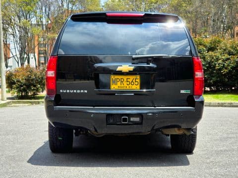 Chevrolet SUBURBAN 2012 usado vista trasera color negro placa amarilla